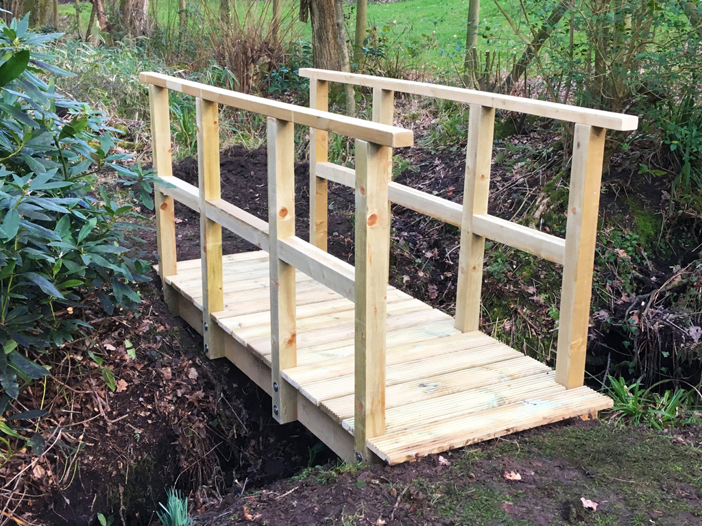 The finished bridge for easy crossing of the stream.