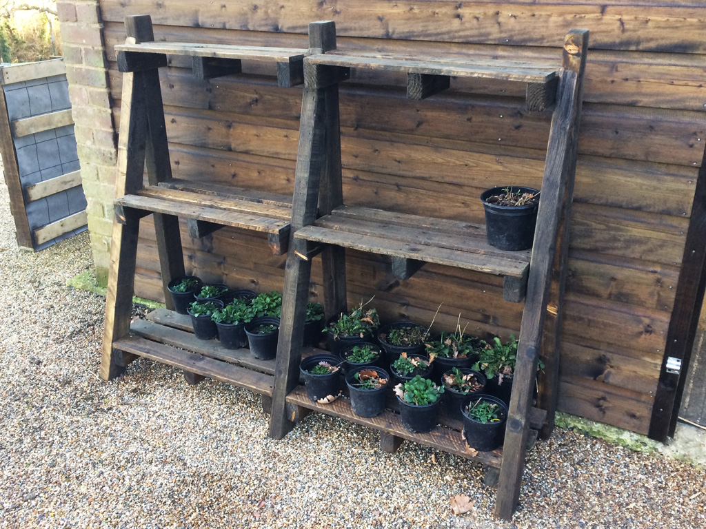 Simple outdoor shelving from reclaimed pallets.